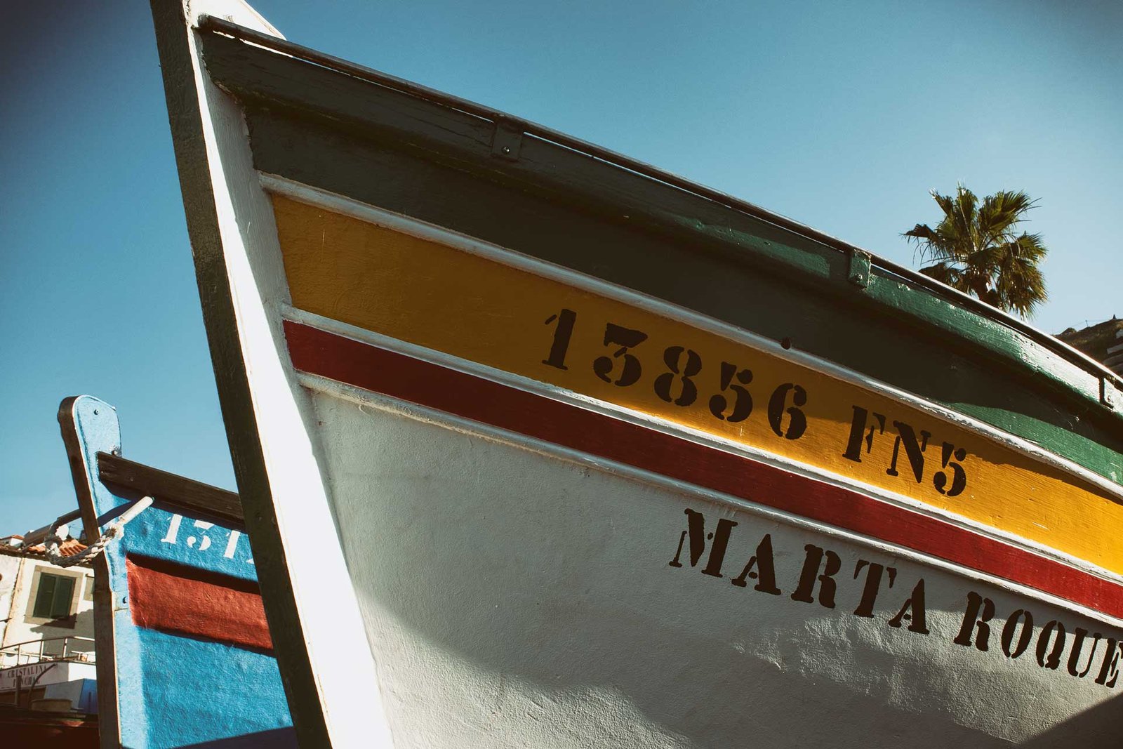 Two colourful anglers boats in Camara de Lobos 