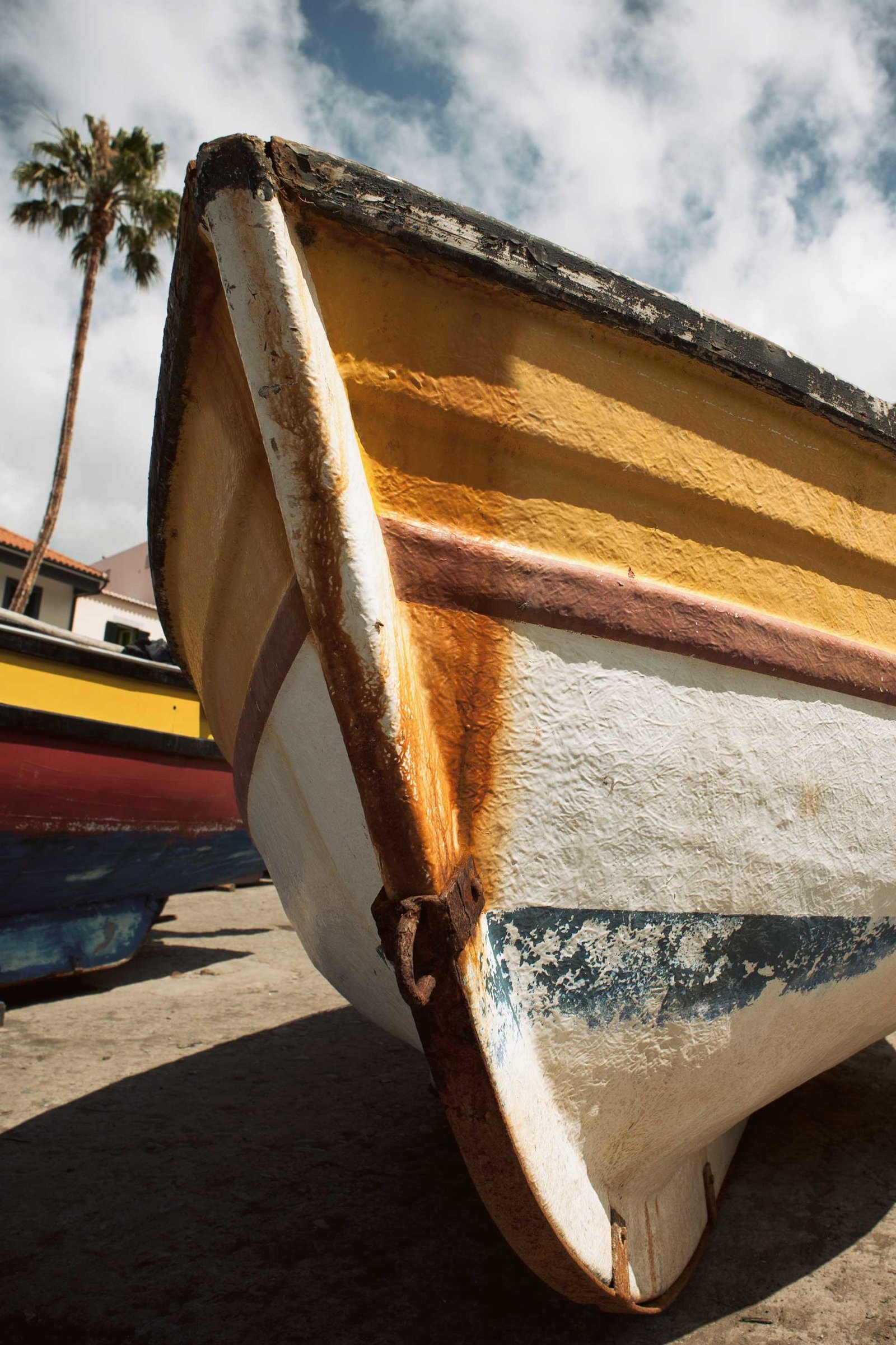 Old rusty fisherman boat on ground in Camara de Lobos