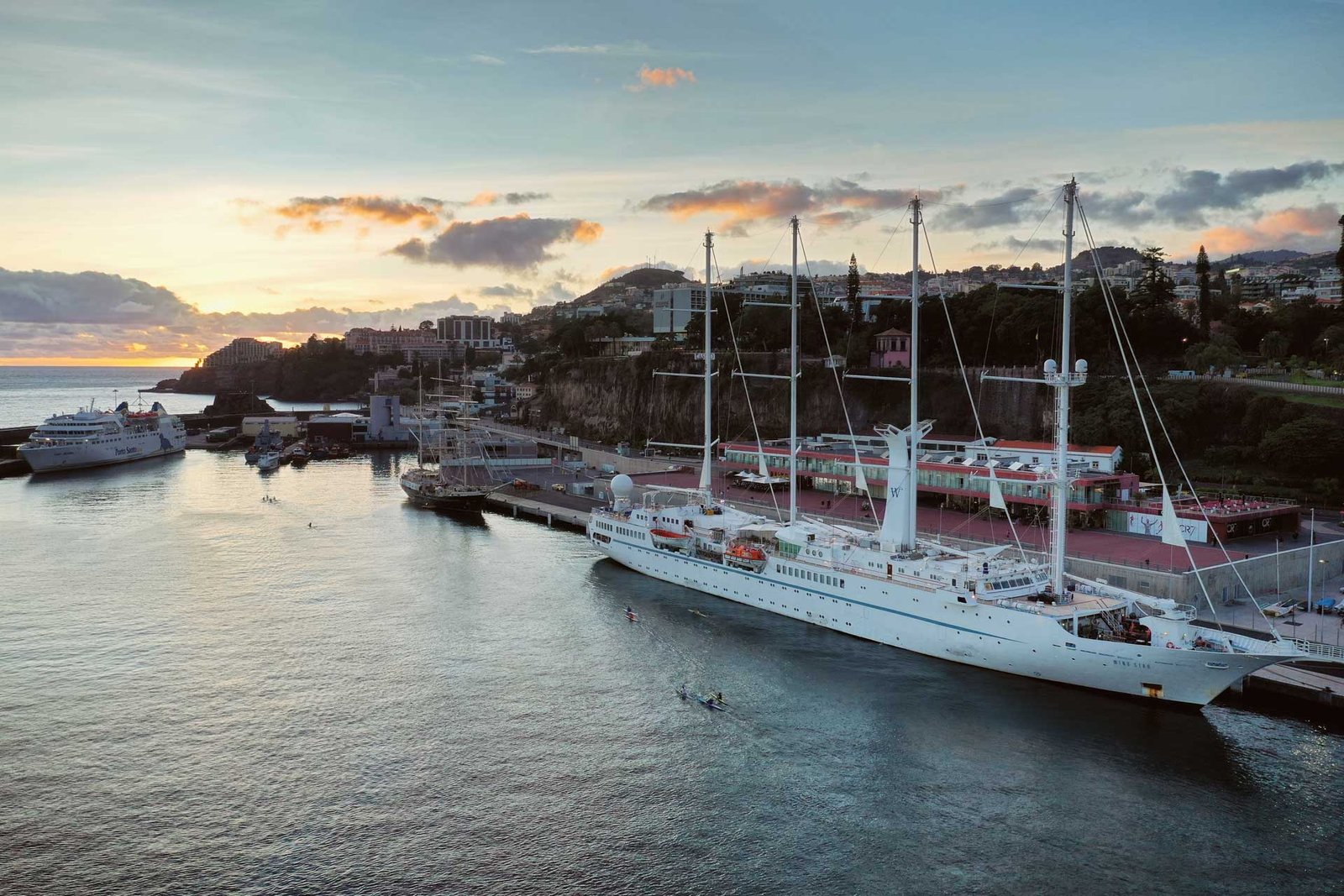 Aerial view at Funchal harbour at sunset with boats in port