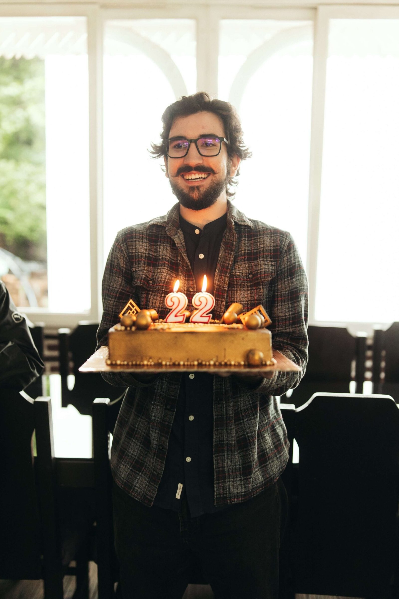 man holding a birthday cake